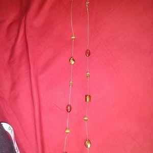 Long gold necklace with glass beads